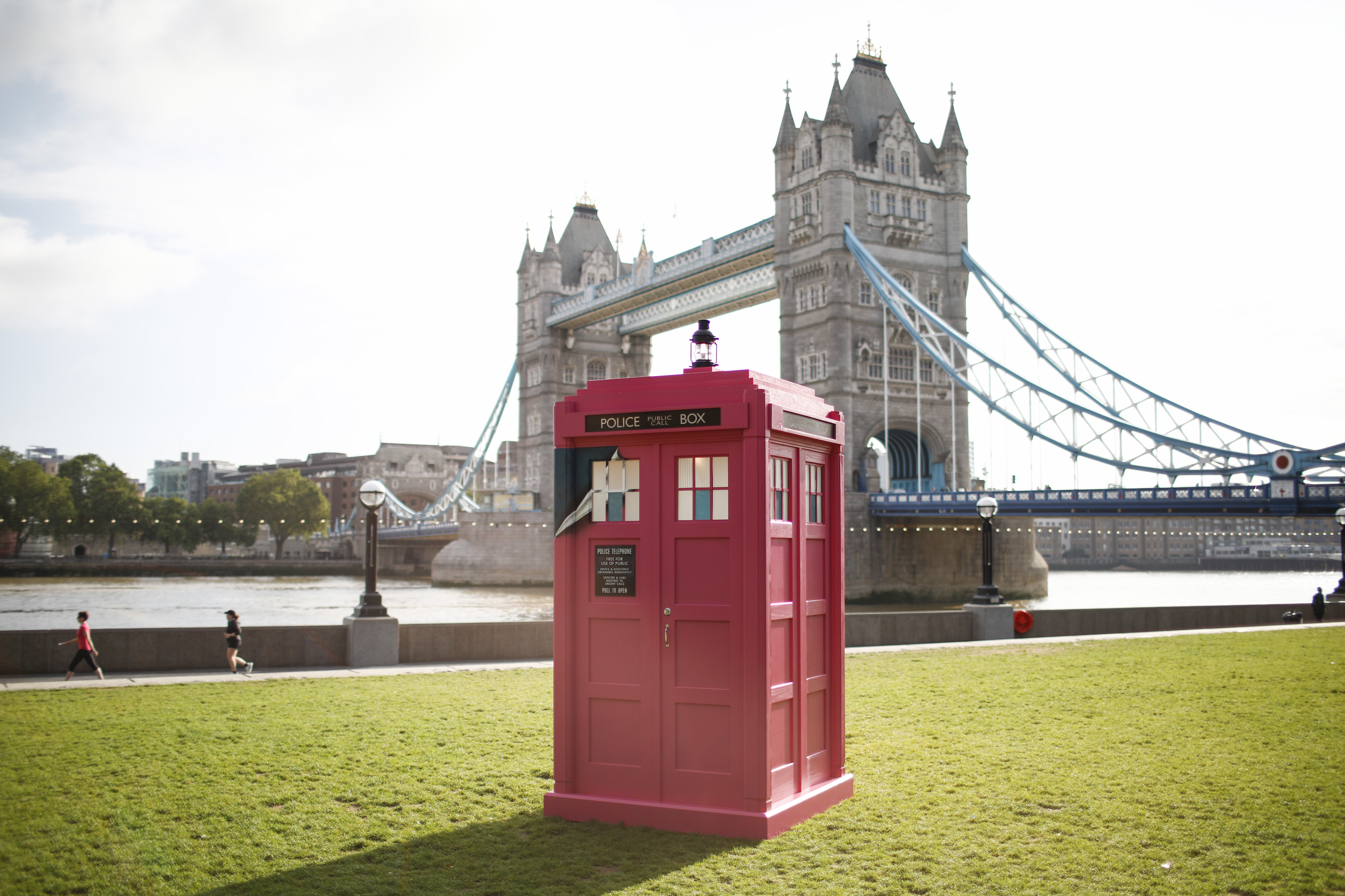 A Pink TARDIS From Doctor Who Has Landed On The Banks Of Tower Bridge